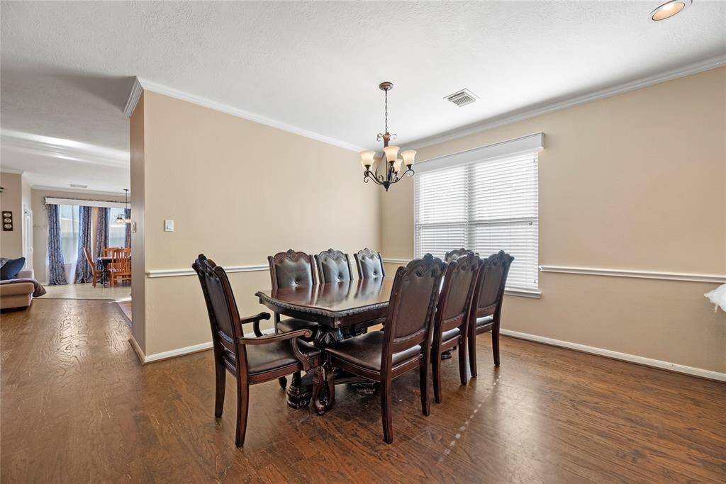 Another look at the dining room. Let's continue past the table into the living room and kitchen area.