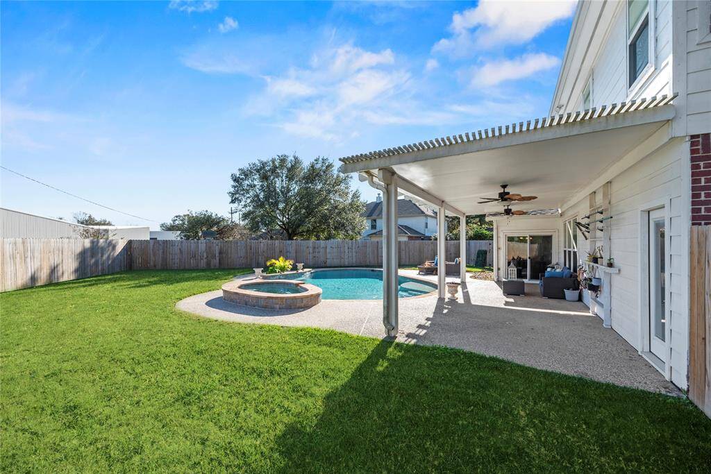 The large covered back porch overlooks the recently refinished pool with recently replaced equipment. Move in ready!