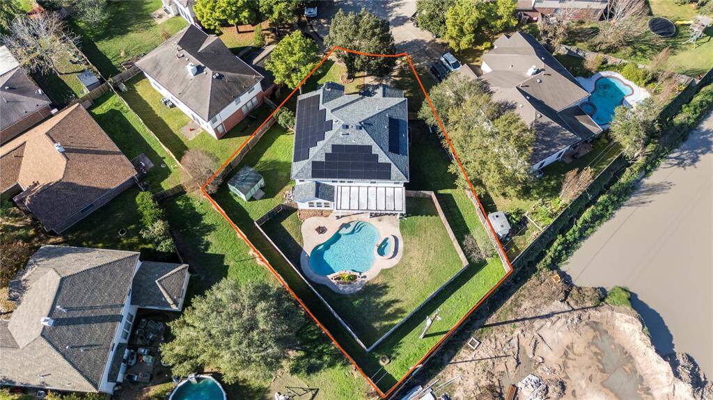 Look at all those solar panels! You also have 2 Tesla battery storage units. This view gives a good look of the actual size of the lot. Just take down the privacy fence to get a more wide open feeling, if you like.