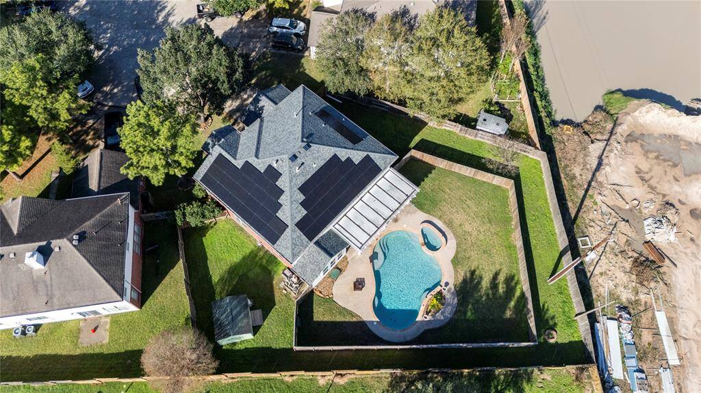 Birds-eye view shows the layout of this property. Sellers built an extra privacy fence that can be kept, or removed to utilize the full space.