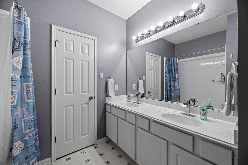 This well appointed full bath services the upstairs bedrooms.