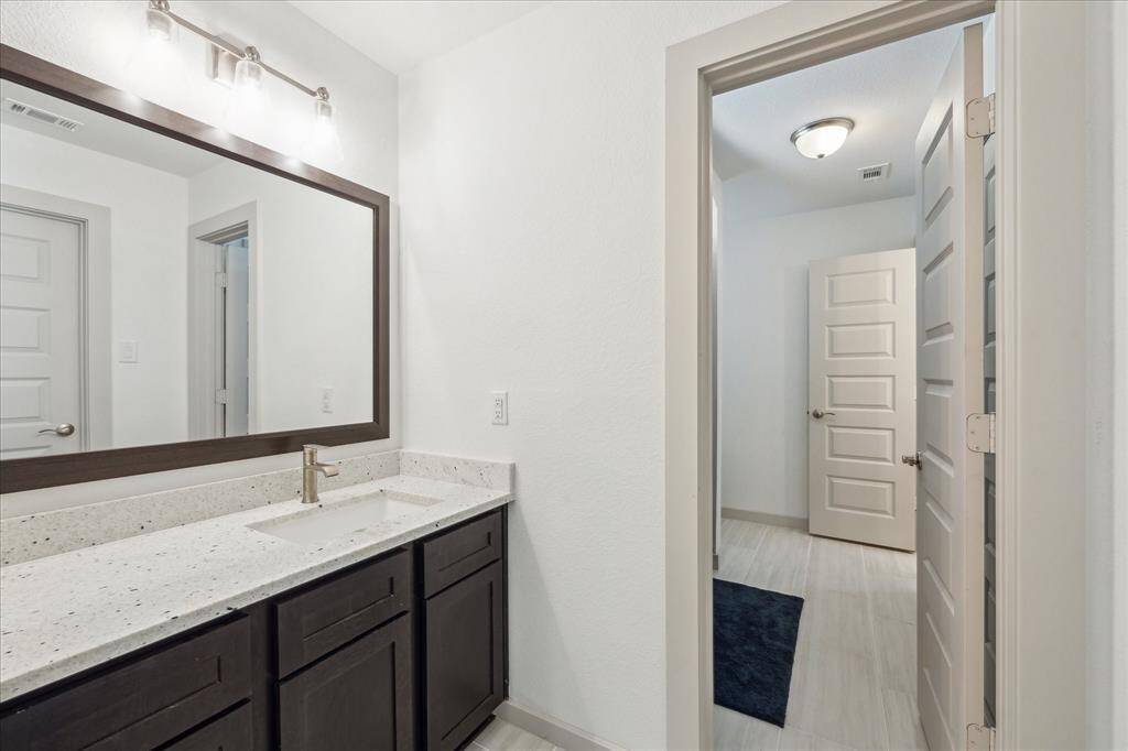 Full bathroom with Tub/shower combo. You are able to still wash your hands and have privacy to take a shower with a separate privacy door