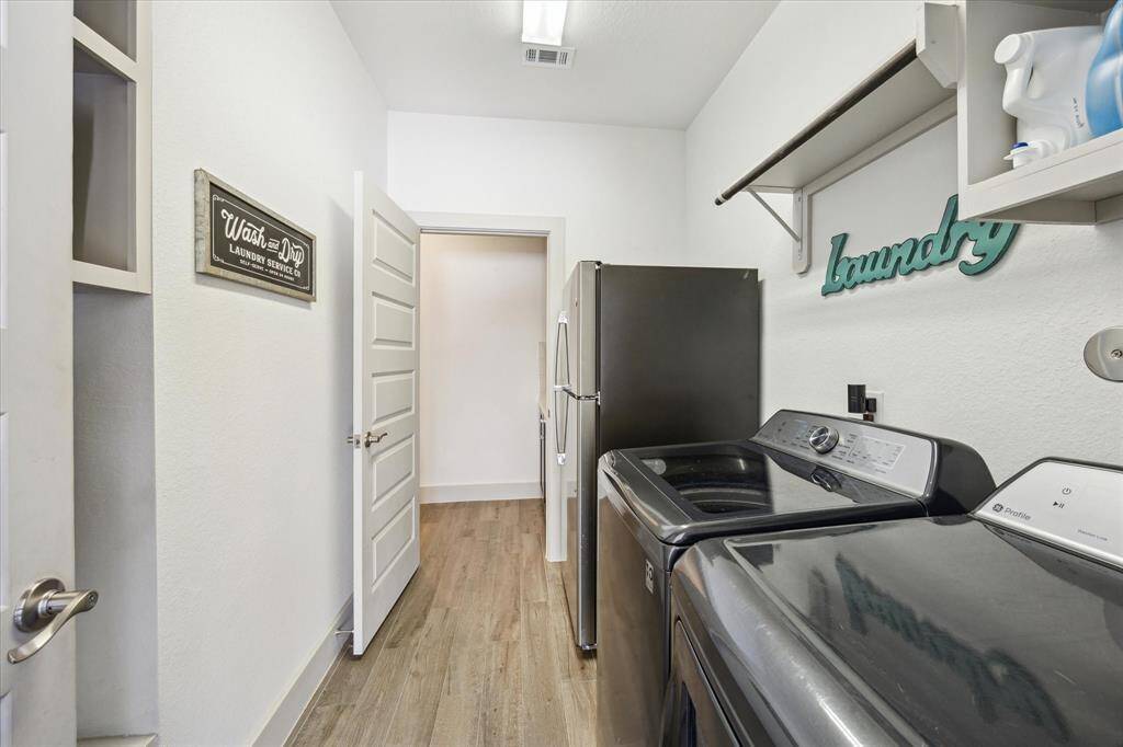 Full bathroom with enclosed glass shower door. Quartz countertop with extended vanity