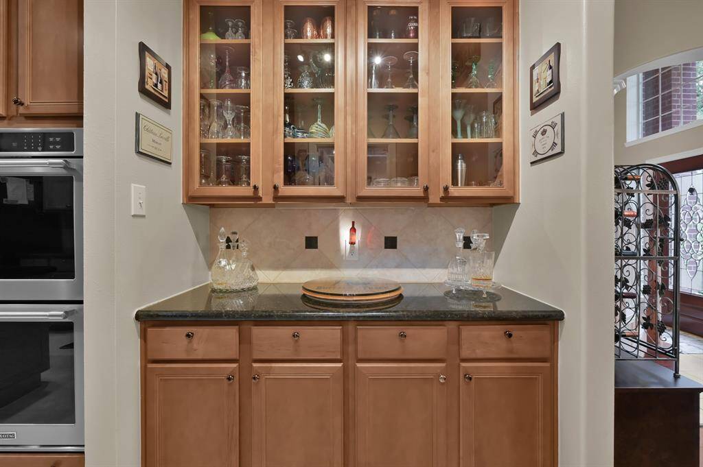 Between the kitchen and formal dining room is this Butler's pantry.  Great storage for extra serving pieces making entertaining a breeze.