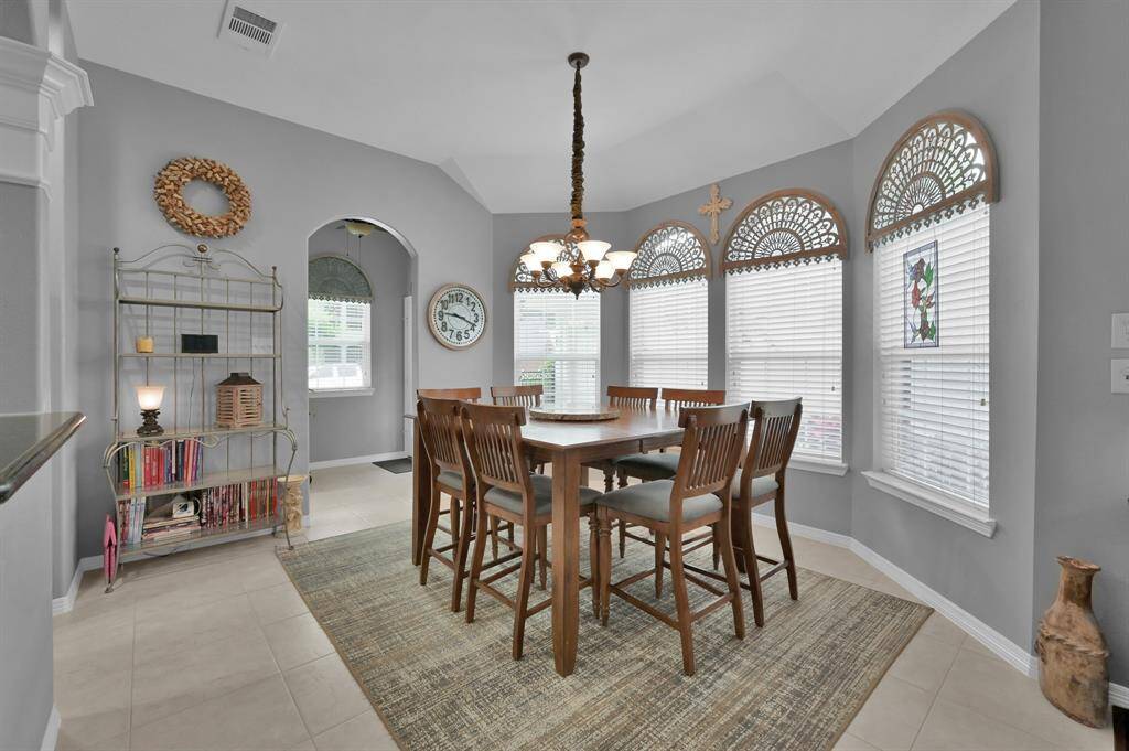 The oversized breakfast area with windows overlooking the backyard. What a great spot for morning coffee or a casual meal.