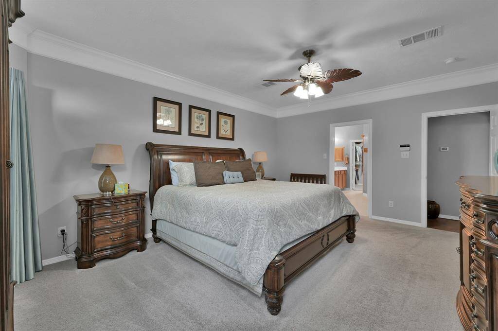 The bedroom is spacious and has room for oversized furniture.
