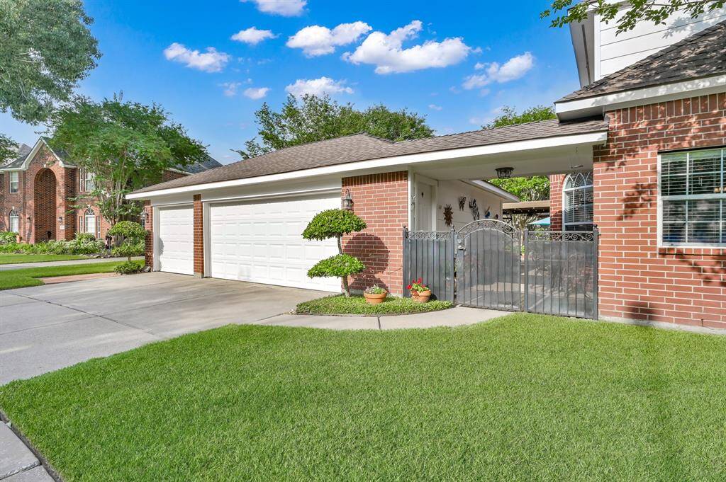 Located on a corner lot with a three car garage and wide driveway for extra parking.