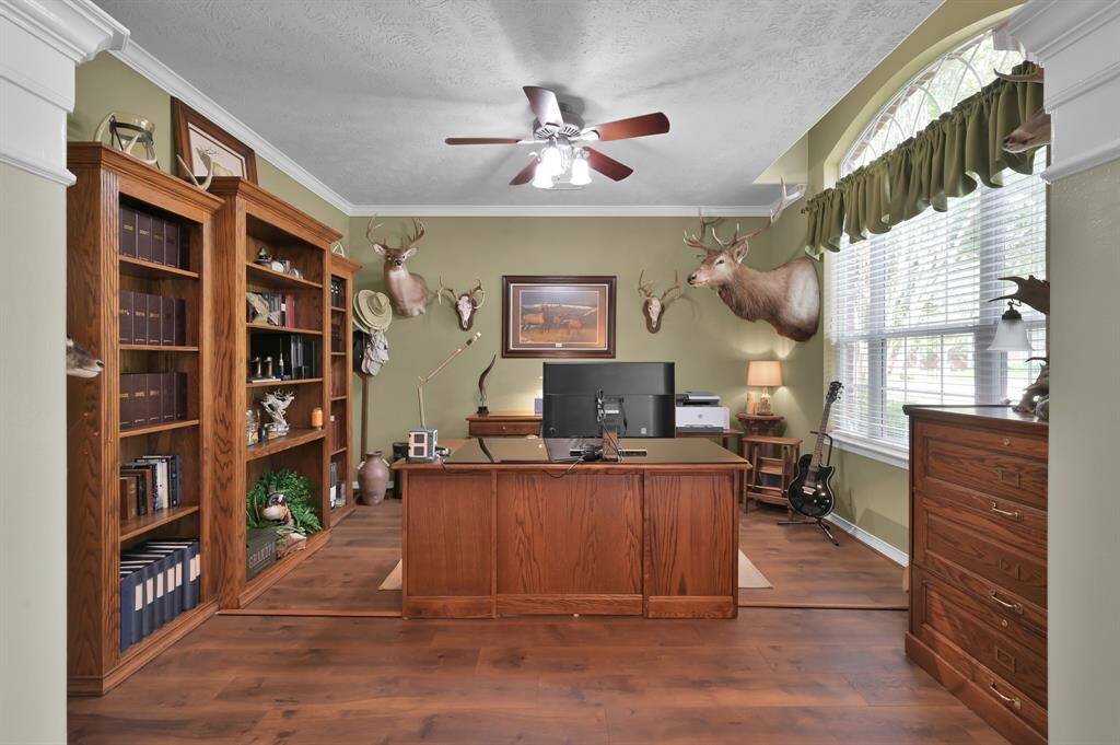 The study is located off the entry, has plenty of room for a home office with views of the outside. Lots of natural light in the home.