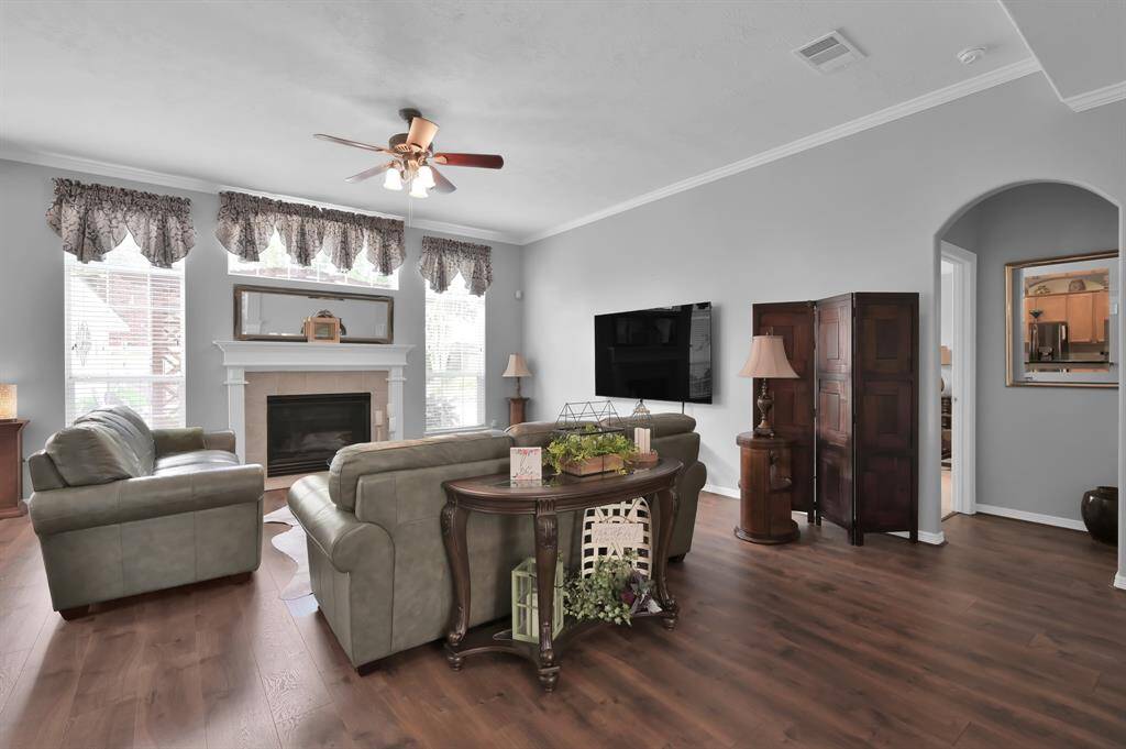The family room overlooks the backyard and has a fireplace with gas logs.
