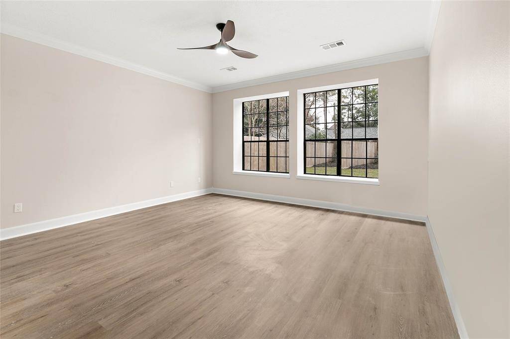 Your owners' retreat  is located on the ground level, overlooking the lush outdoors & private backyard.