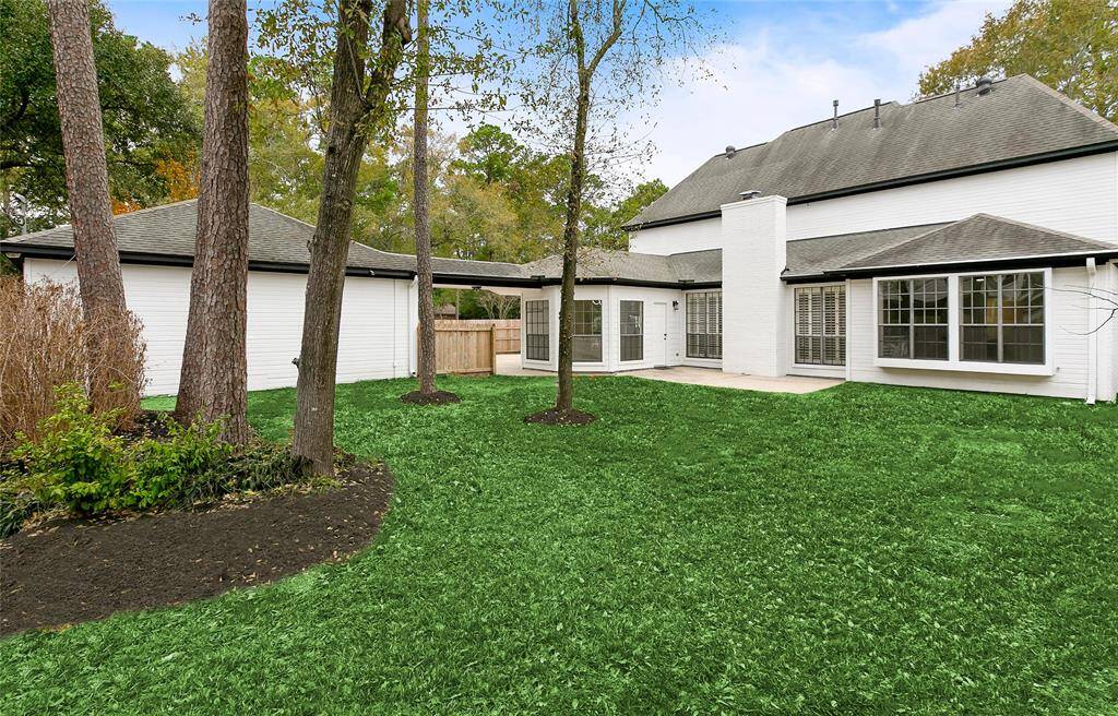 Enjoy the spacious backyard with lush green grass and mature trees. From the interior, large windows allow ample natural light & views of the serene outdoors from many rooms.