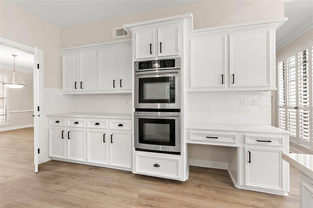 Kitchen features a built-in oven/microwave, ample counter space plus a work desk to organize those special meals.