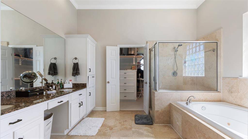 Primary bathroom with standing shower and soaking tub