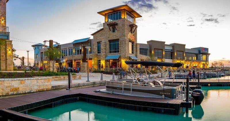 Enjoy waterfront dining, shopping, and entertainment at The Boardwalk in Towne Lake—a vibrant lakeside destination with stunning views and easy access by land or boat.