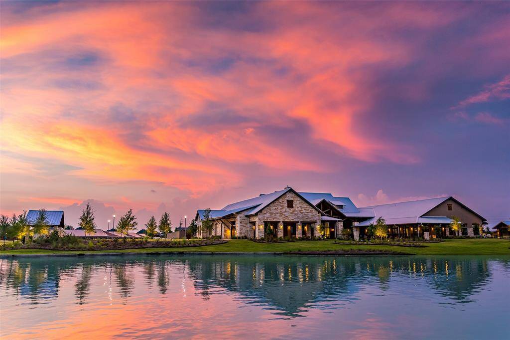 Breathtaking waterfront living in Towne Lake—where every evening ends with stunning sunset views over the water and lakeside homes offer unmatched serenity and style.