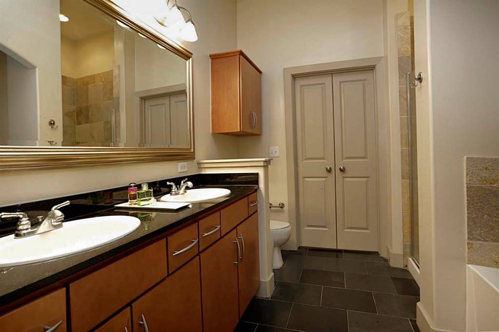 Main Bathroom with double sink, separate tub and shower.