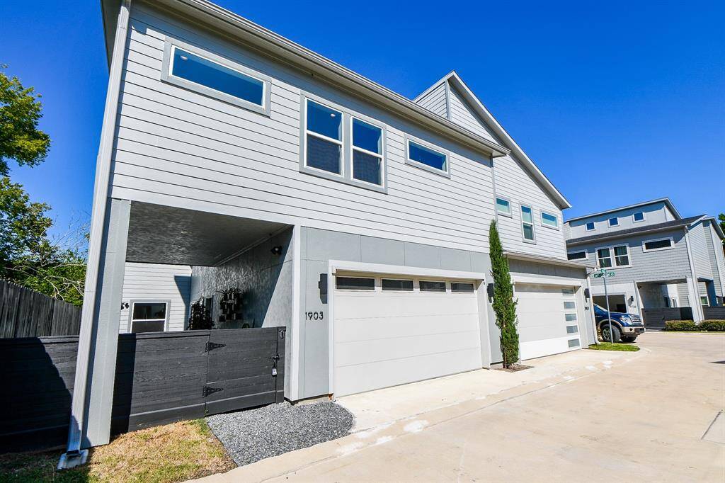 This corner townhome has a large double car garage and secured gat entry into the courtyard.