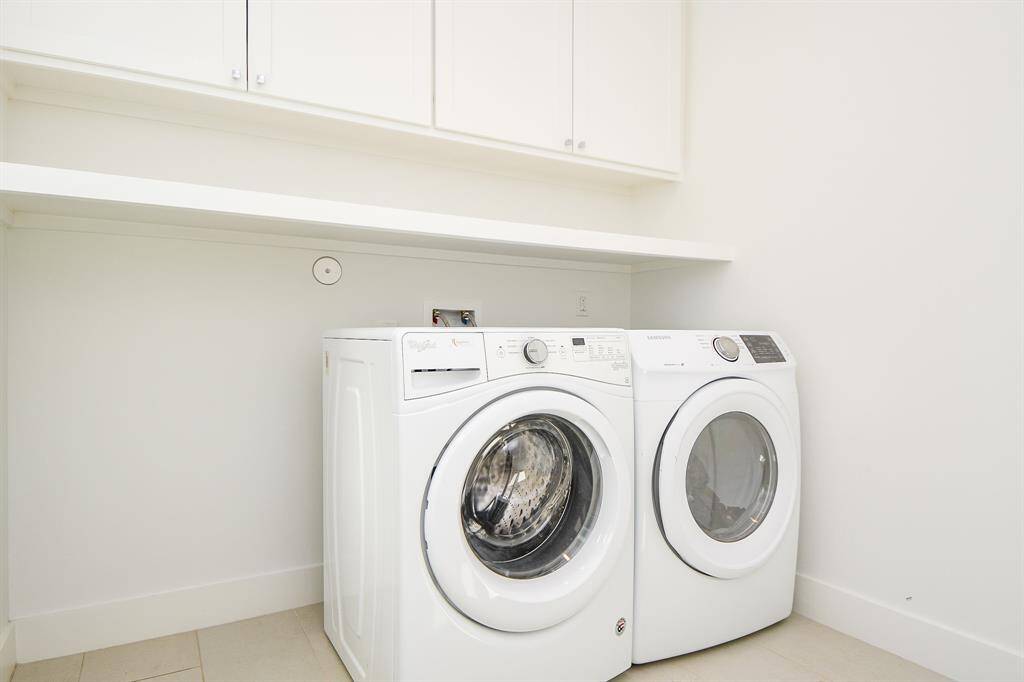 The laundry room upstairs is very large and has a separate large storage room next to it.