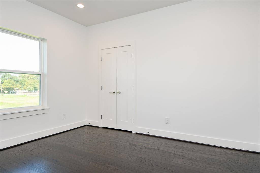 A secondary bedroom upstairs.  Every room has beautiful wood floors.