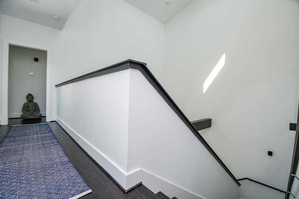 The upstairs landing leading to the third bedroom and bath.