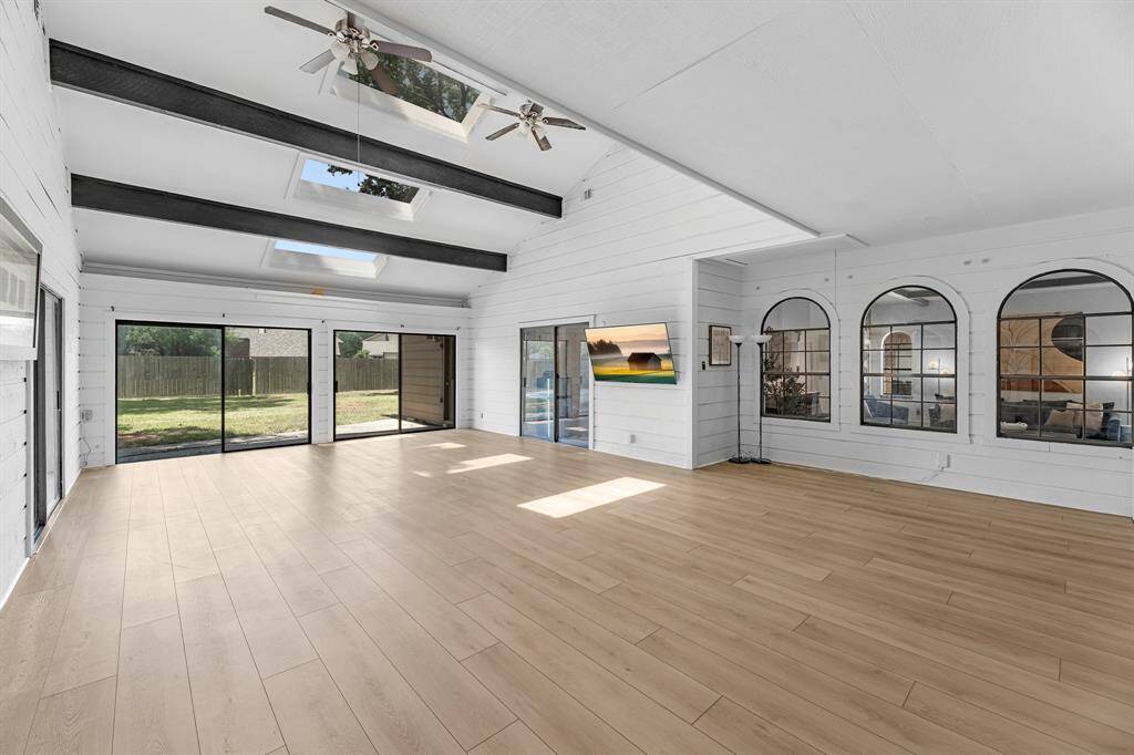 Climate-controlled with skylights and sliding doors to the backyard.
