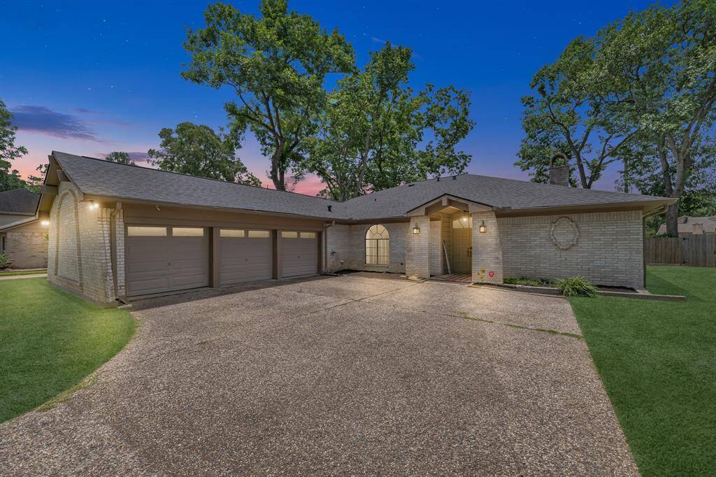 Beautiful curb appeal with 3-car garage and welcoming entry.