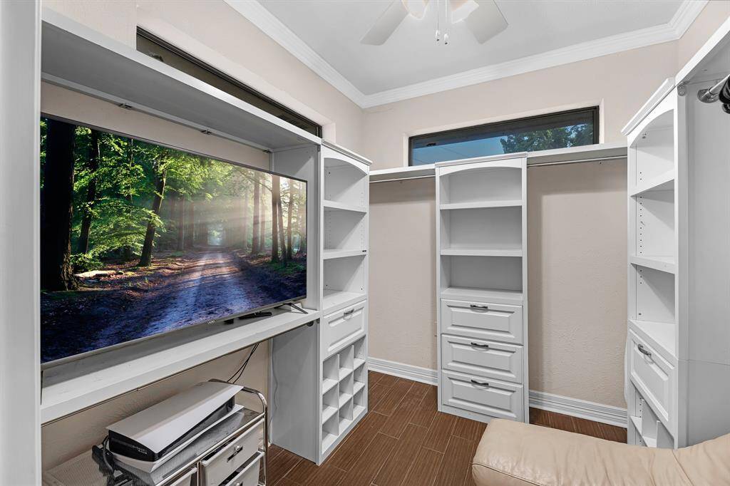 Built-in shelves, drawers, and even space for a TV.