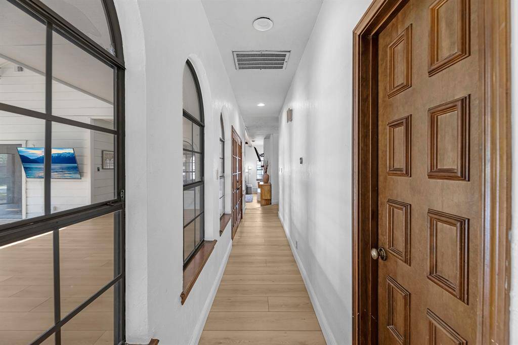 Spacious hallway connecting the home’s main living areas.