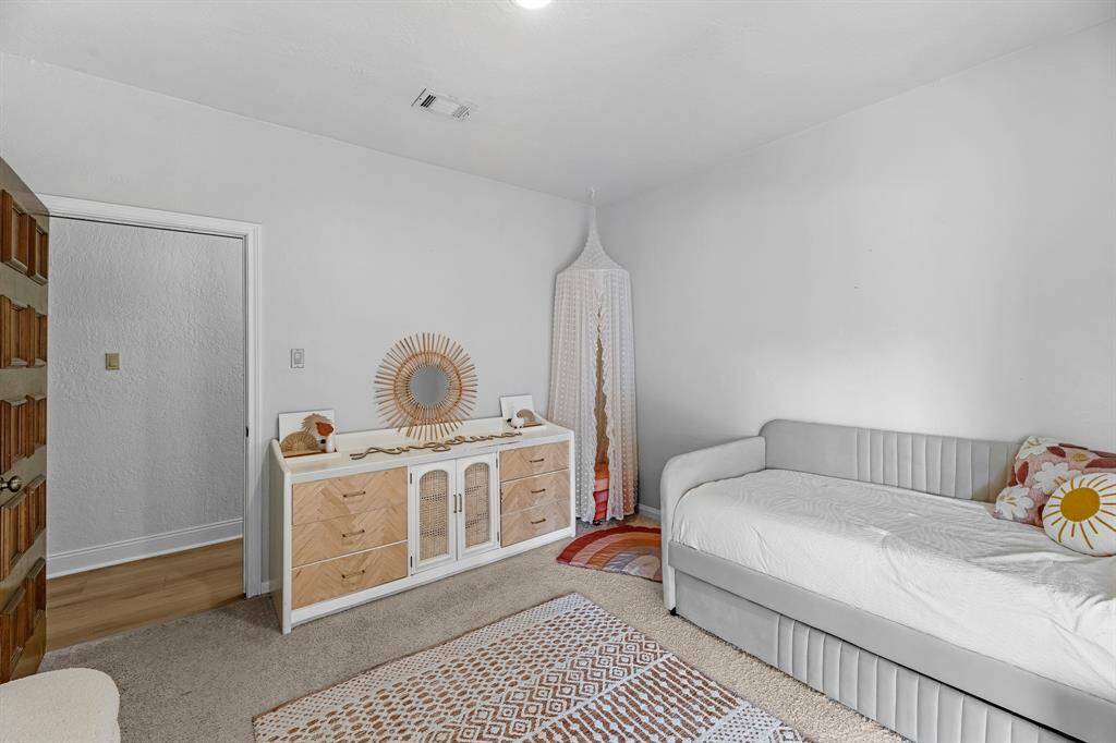 Playful and modern with warm accents and carpet.