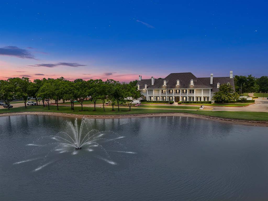 Experience luxury and Southern charm at its finest with this stunning community clubhouse. Nestled beside a peaceful pond with a lighted fountain, this grand venue offers an elegant space for social gatherings, events, and community celebrations. The beautiful architecture, serene water views, and manicured landscaping create a picturesque backdrop for entertaining and relaxation.