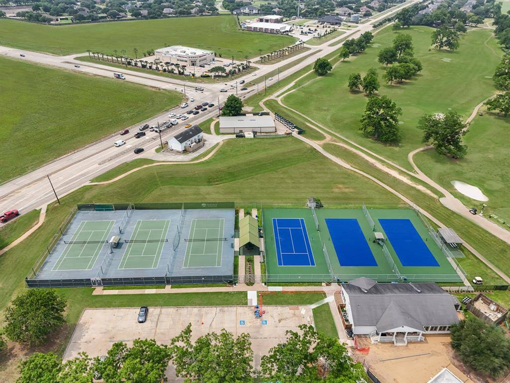 Enjoy an active lifestyle with access to this impressive tennis complex featuring both traditional and pickleball courts. Whether you’re playing a casual match or practicing your serve, this facility has everything you need—multiple courts, shaded seating areas, and nearby clubhouse access. Located just minutes from the main entrance, it's a hub for fitness and friendly competition.