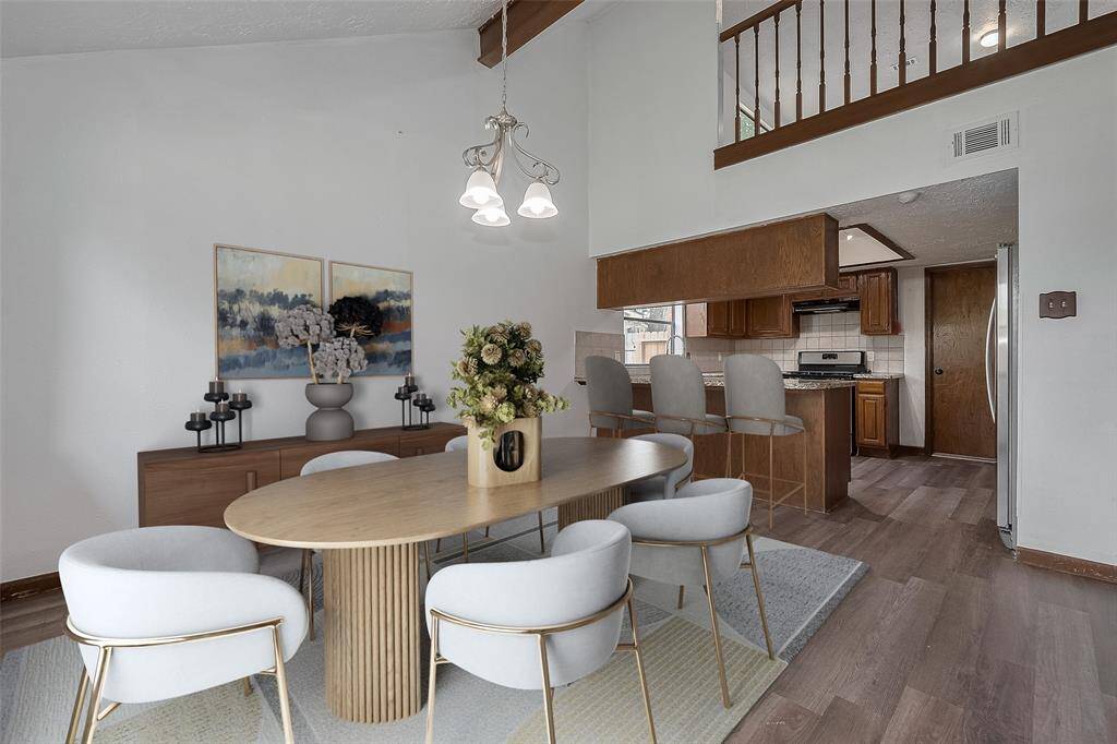 A vaulted ceiling adds volume to the space, while backyard views create a relaxing ambiance.
