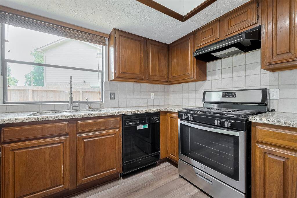 Stainless steel appliances and granite countertops combine for a kitchen that's both stylish and functional.