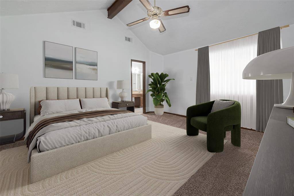 The spacious primary bedroom features high ceilings and a private ensuite bath for added comfort and convenience.