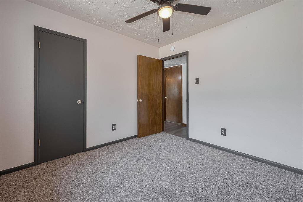A view from inside the same bedroom highlights a closet and direct access to the main hallway