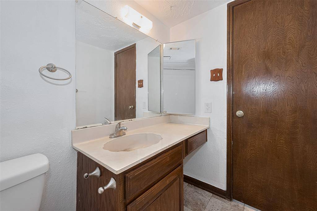 A wide vanity with under-sink storage makes morning routines simple and efficient for guests or family.