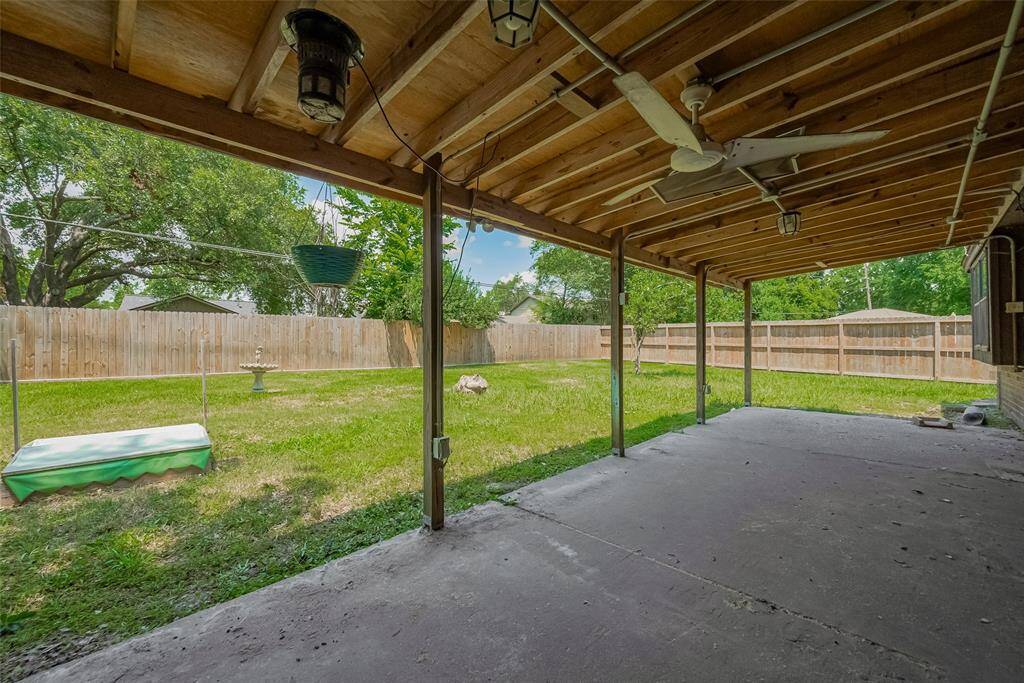 With ceiling fans and lighting already installed, this patio is ready for any weather, day or night.