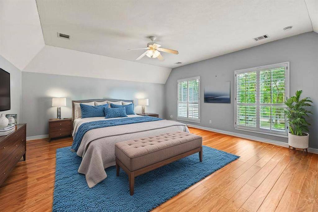 The third bedroom upstairs is a graciously sized retreat, thoughtfully appointed to provide both comfort and sophisticated charm