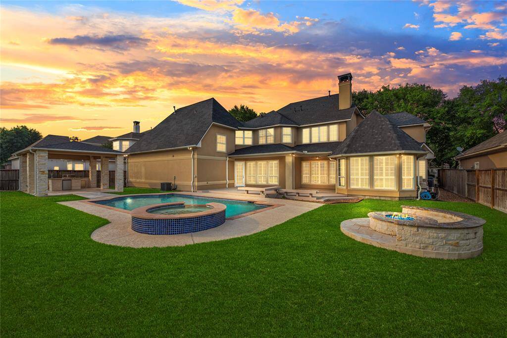 As dusk falls, the carefully curated lighting beautifully accentuates both the home and the pool, casting a warm, enchanting glow that elevates the entire outdoor ambiance.