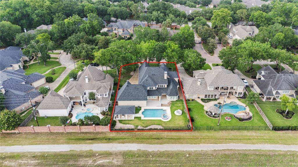 Situated in a prime location, this exceptional home boasts a stunning pool and the privacy of no rear neighbors—an ideal sanctuary perfectly tailored for family living and memorable gatherings.