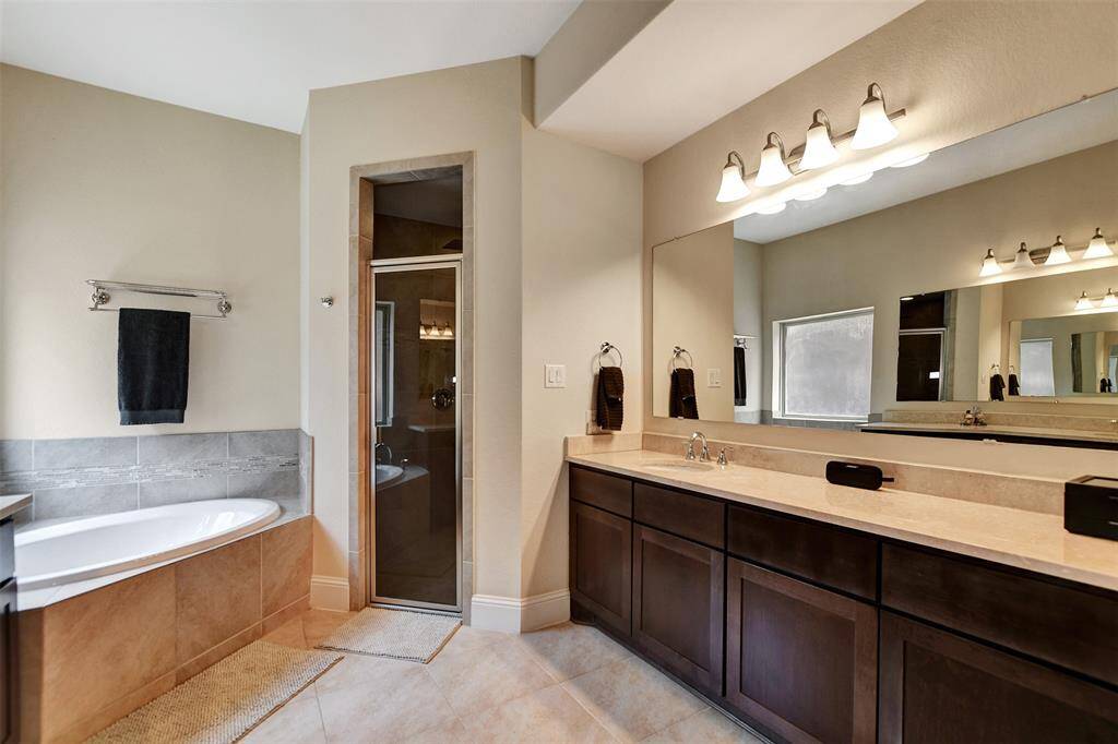 Separate tub and large shower with upgraded rain shower.