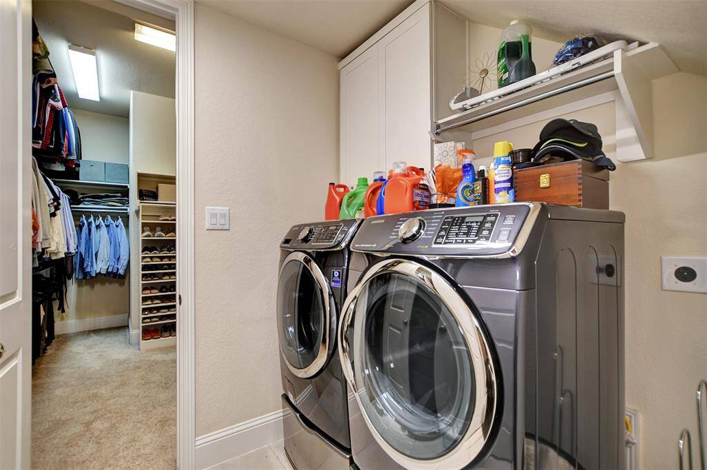 Utility Room with shelve, cabinets, sink, and storage.