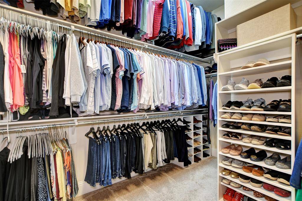 Primary bedroom dream closet. Custom made for all your needs.