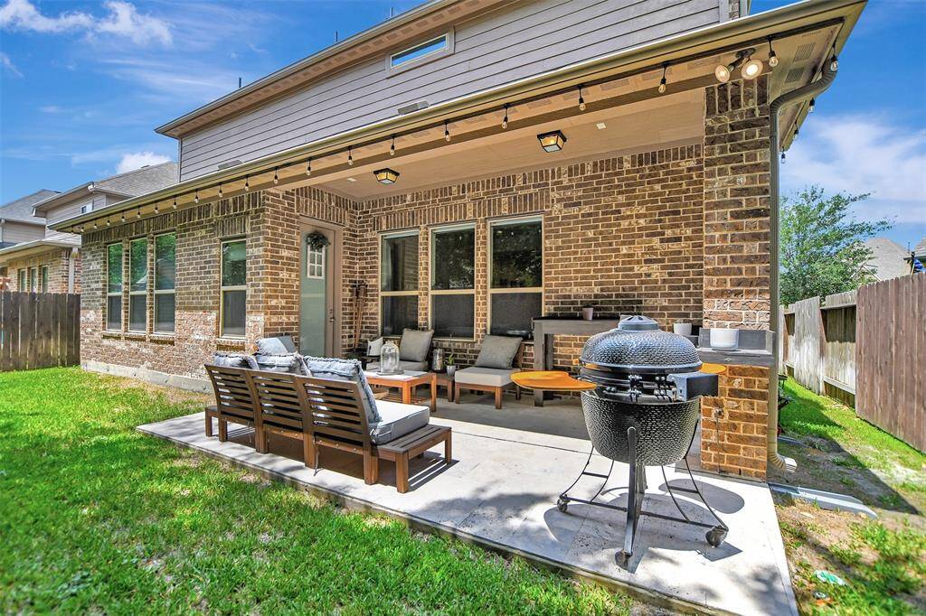 Experience seamless indoor-outdoor living in this beautifully designed backyard retreat