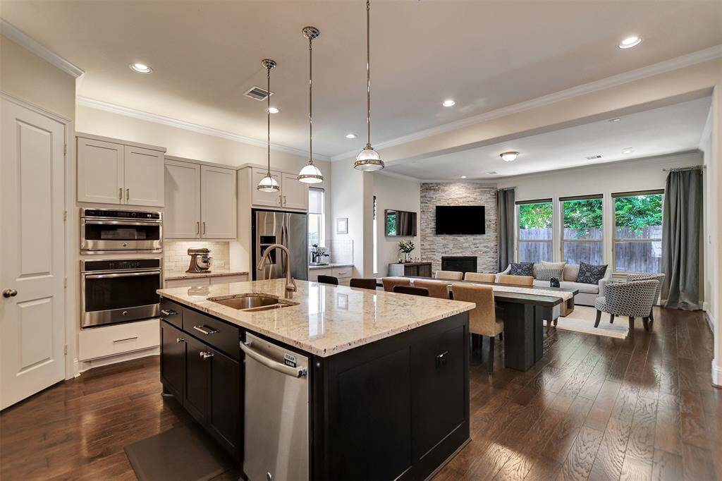 Step into a home that welcomes you with warmth and sophistication. The open-concept layout features  high ceilings, and stunning wood flooring that enhances the sense of space and luxury.