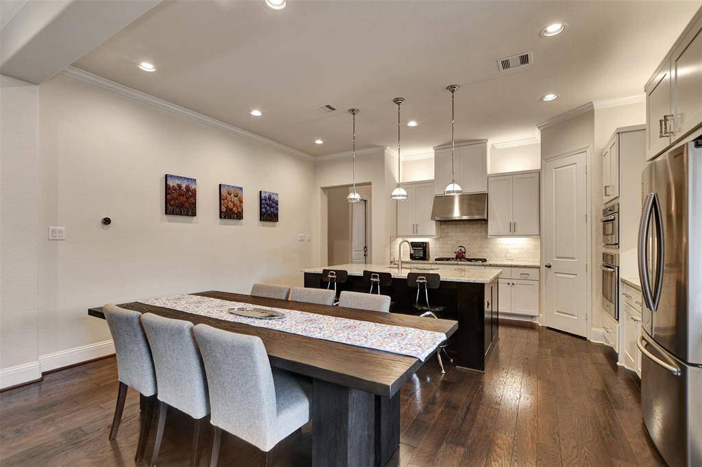 Kitchen upgrades include: counter depth refrigerator, high end wood floors, modern light fixtures, undermount lighting, upscale appliances, and more.
