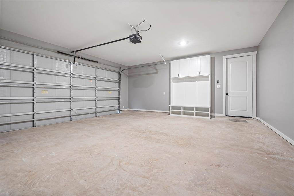 Large two car garage with a great built-in mud area.