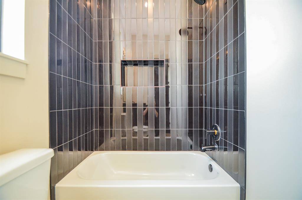 Tub in one of the 3 full bathrooms downstairs.