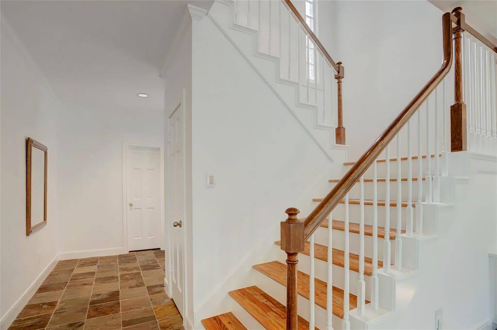 Laundry Room - Located off the kitchen with access to the garage.