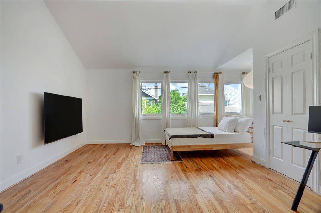 Primary Bathroom - Dual vanities, updated lighting and mirrors with views to the front of the home.